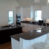 White Thermofoil w/Stained Island - Built for Christi Construction